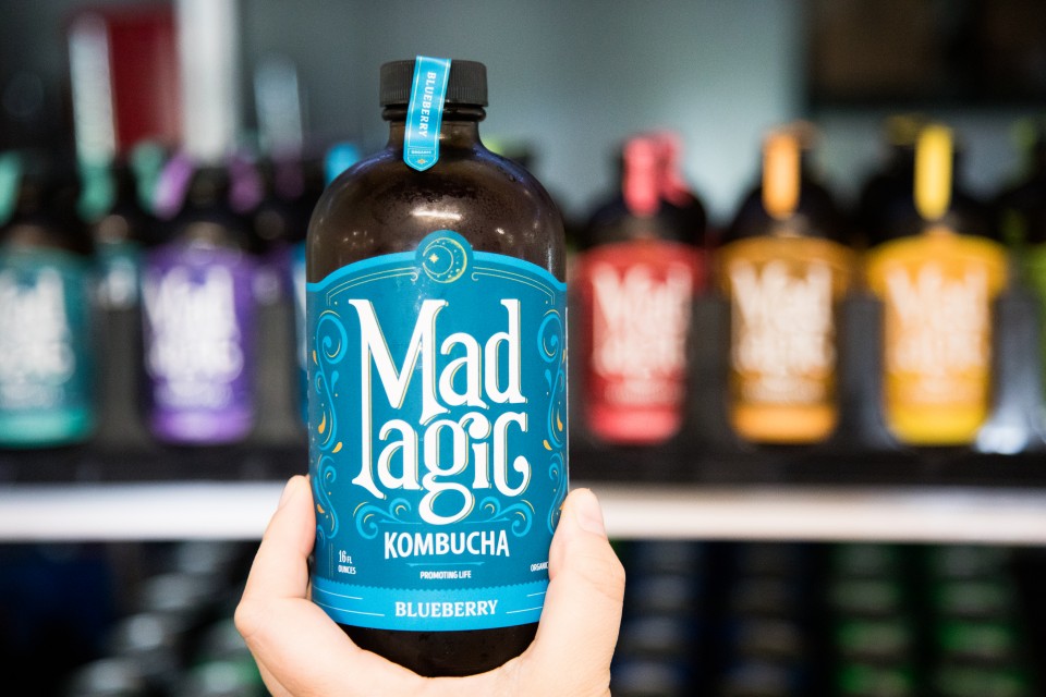 Mad Magic Blueberry Kombucha with the bright Blue label in the farm Market at Great Country Farms