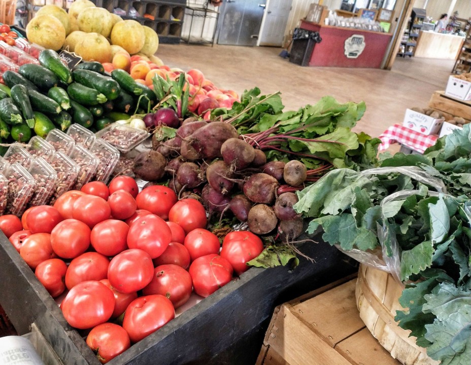 Fresh tomatoes, beets, zucchini and cantaloupe grace the shelves in the Farm Market at Great Country Farms