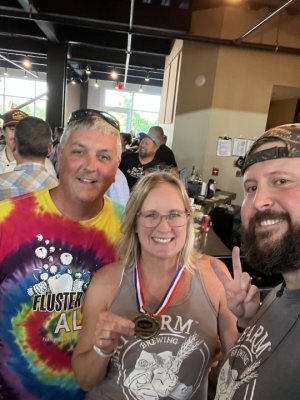 The Team from Dirt Farm Brewing proudly display their gold medal from the Virginia Craft Beer Cup for their new Peachy Mother Pucker Sour Ale.